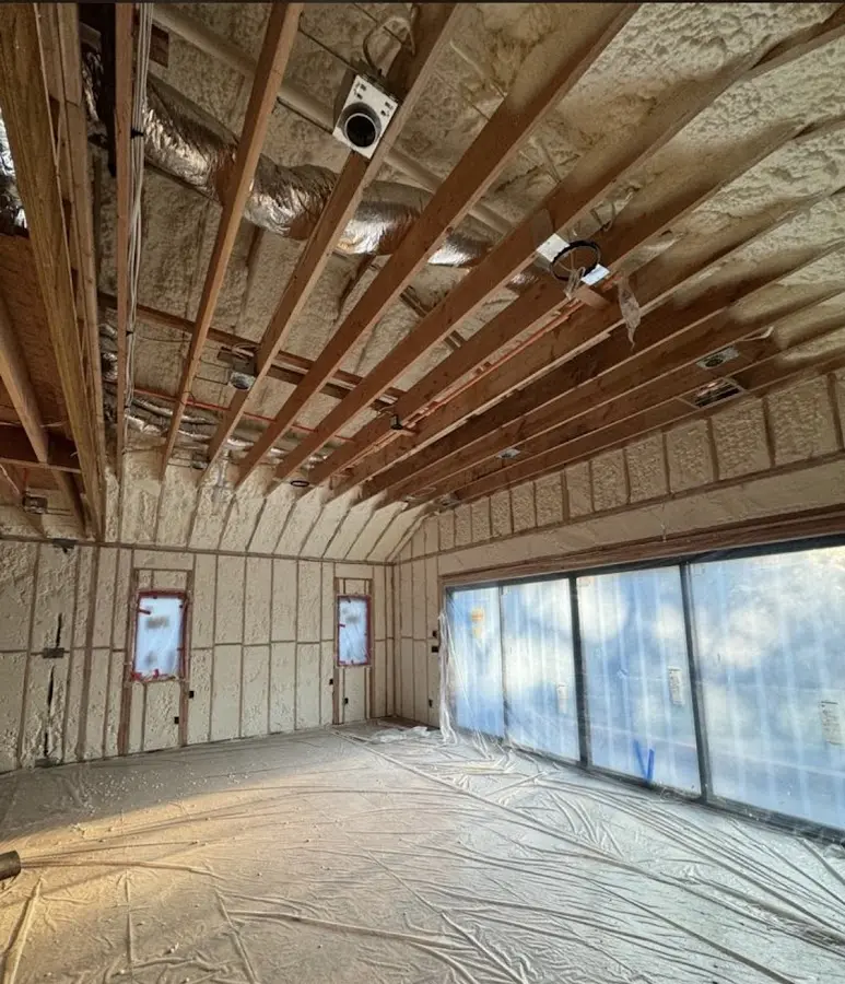Interior walls and ceiling insulated with spray foam during new construction in Schenectady